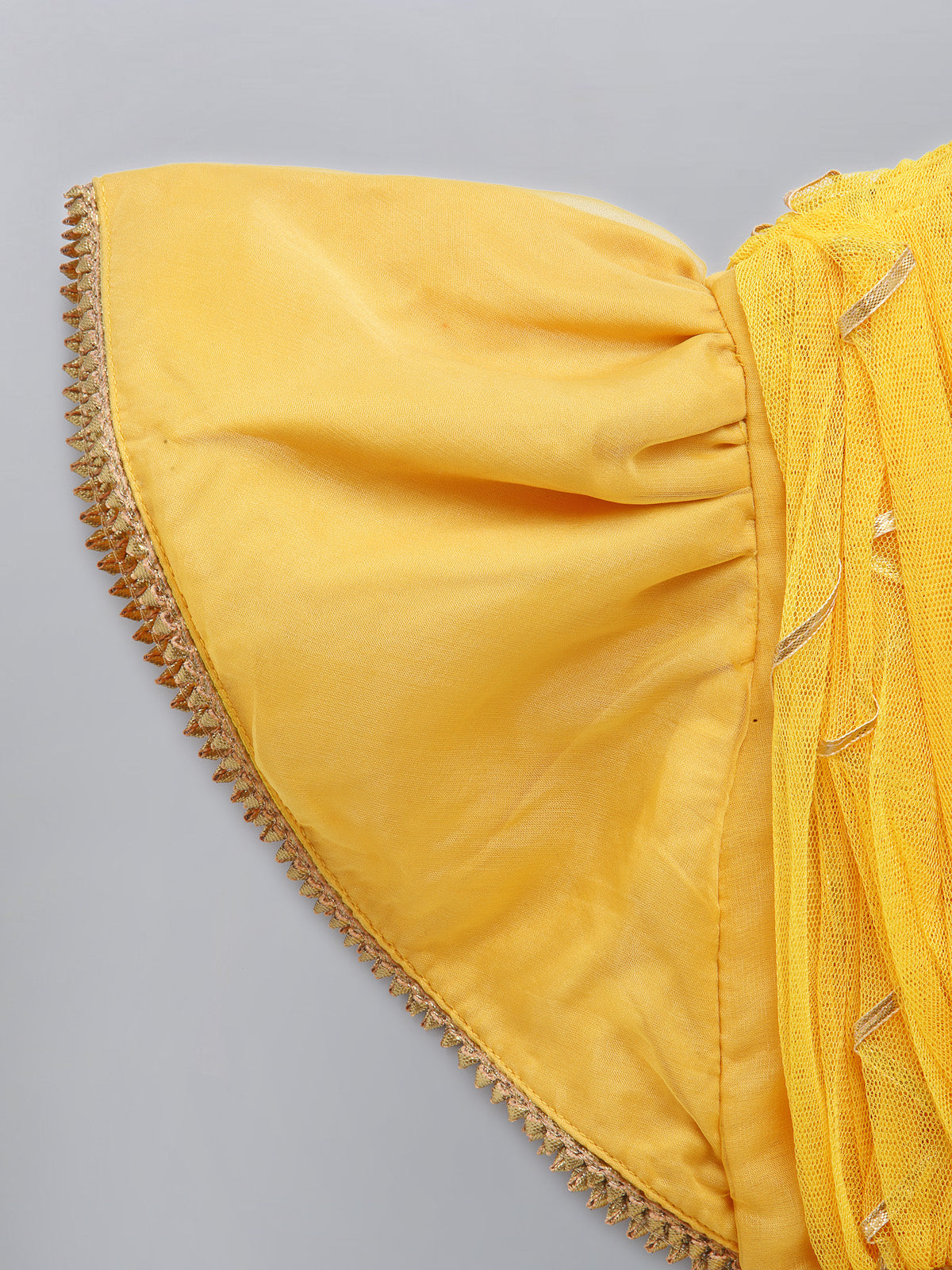 Mustard Blouse with attached net Dupatta and double layered lehnga